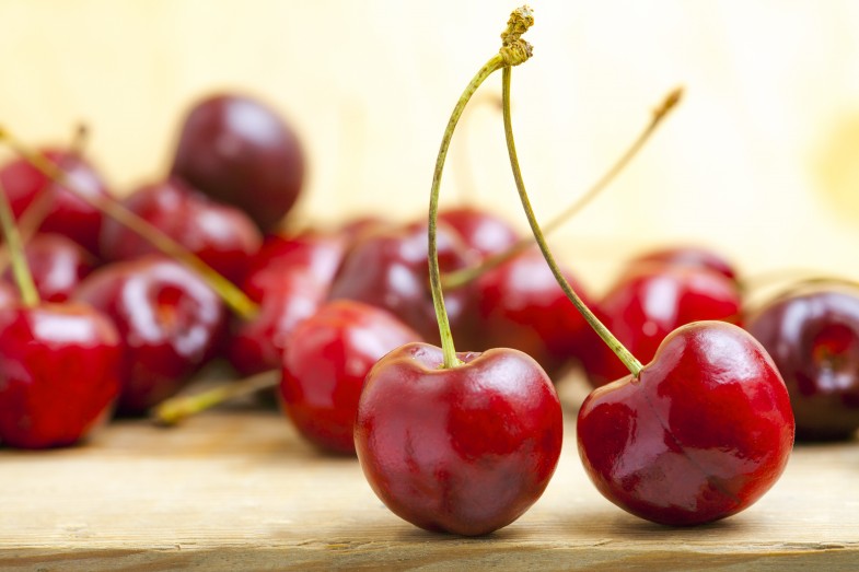 bigstock-fresh-red-cherries-on-a-wooden-45802765-785x523