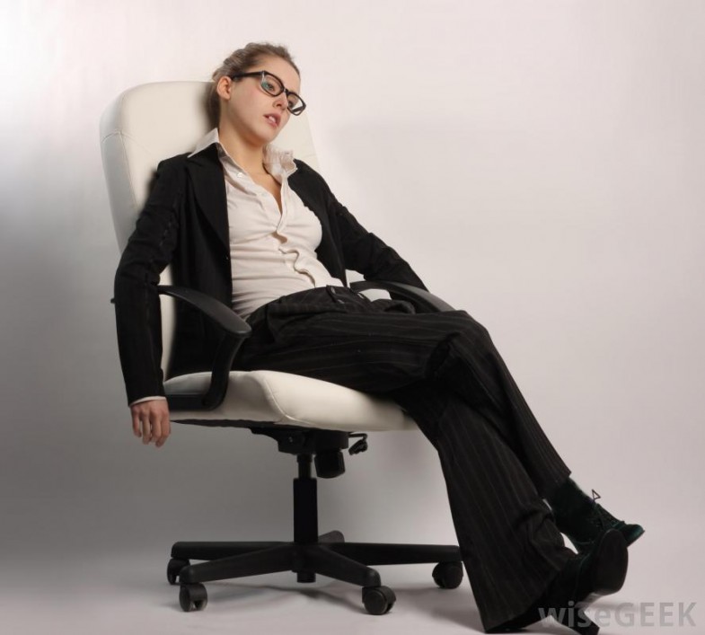 tired-woman-in-suit-sitting-on-chair